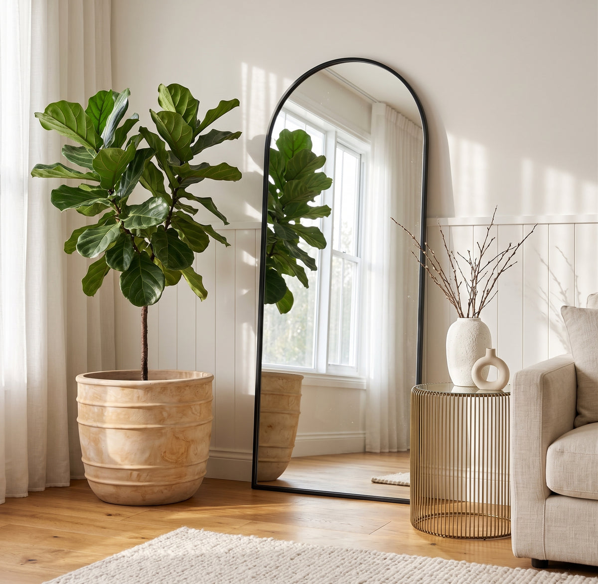 Antique terracotta Olympic planter styled with indoor tree by arched mirror