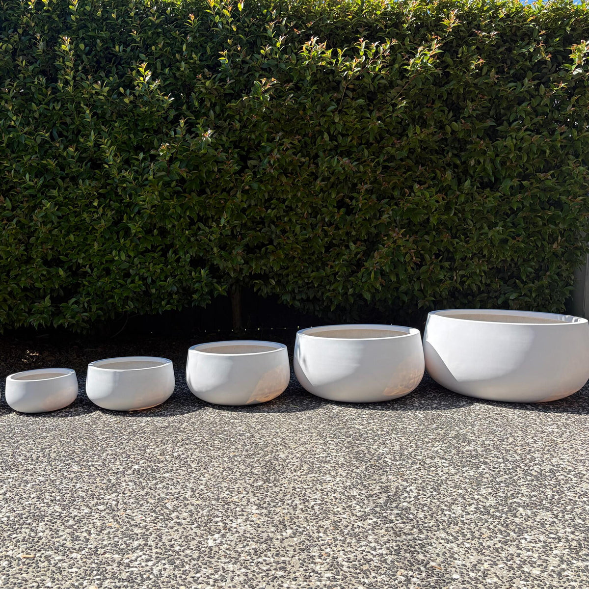 Side profile size comparison of Andy pure white round bowl planters XS to XXL