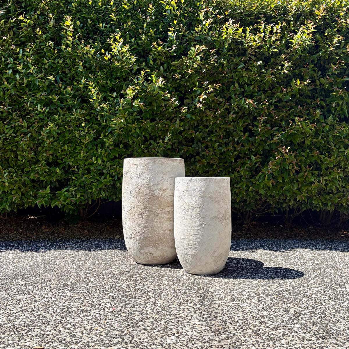 Pair of White Pietra false bottom tall composite planters on gravel