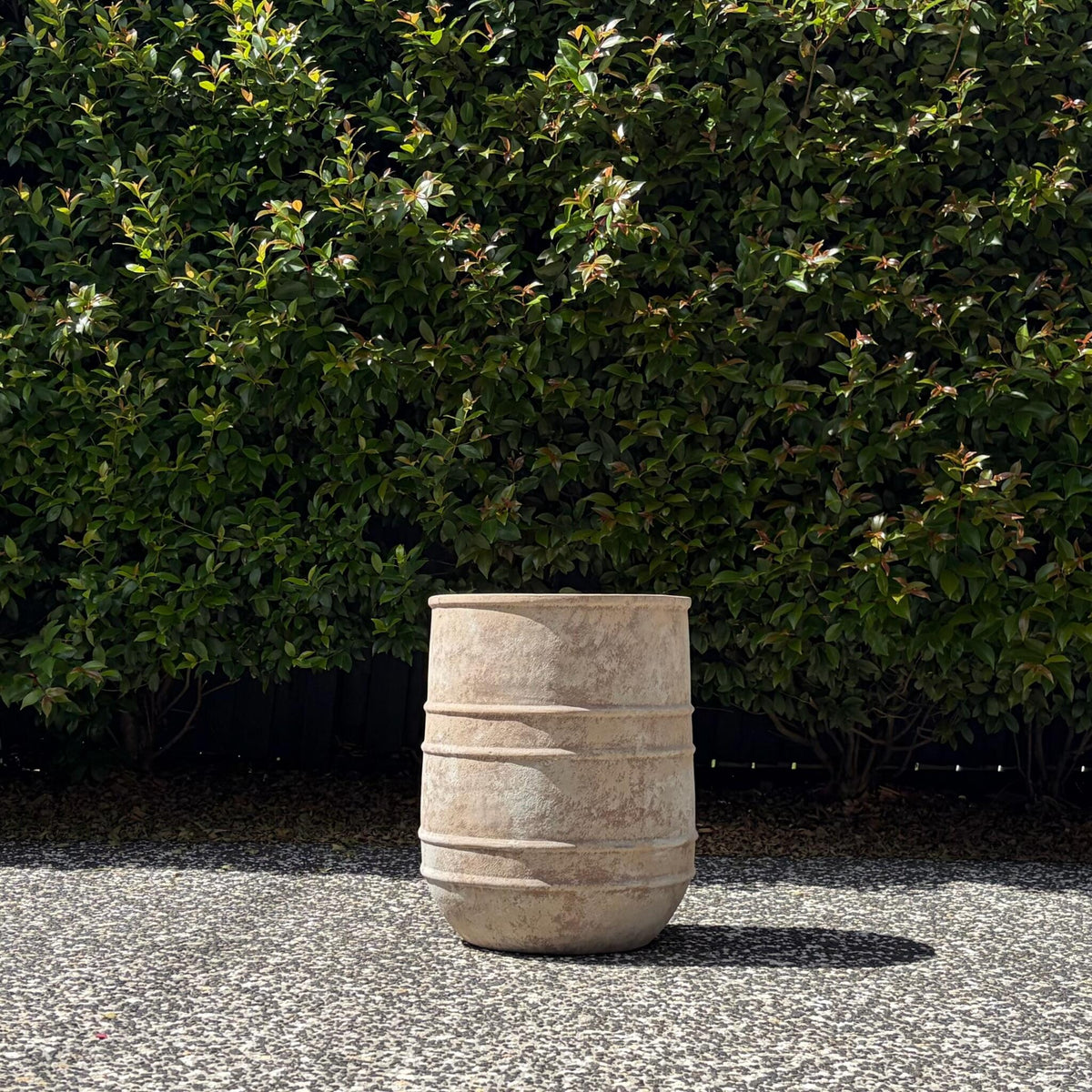 Large antique terracotta horseshoe planter with horizontal band detailing