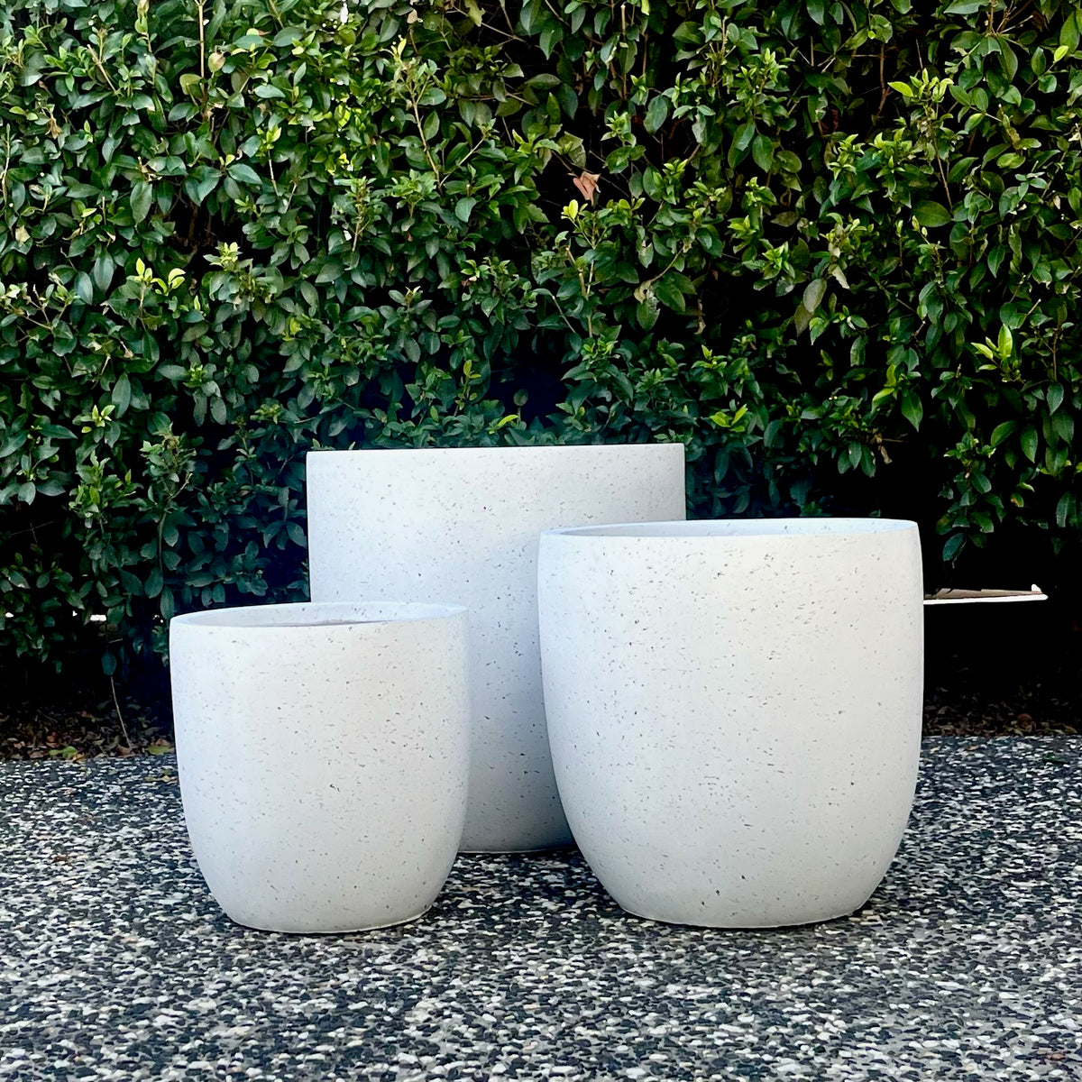 Trio set of pure white Asher egg planters highlighting smooth round curved profile